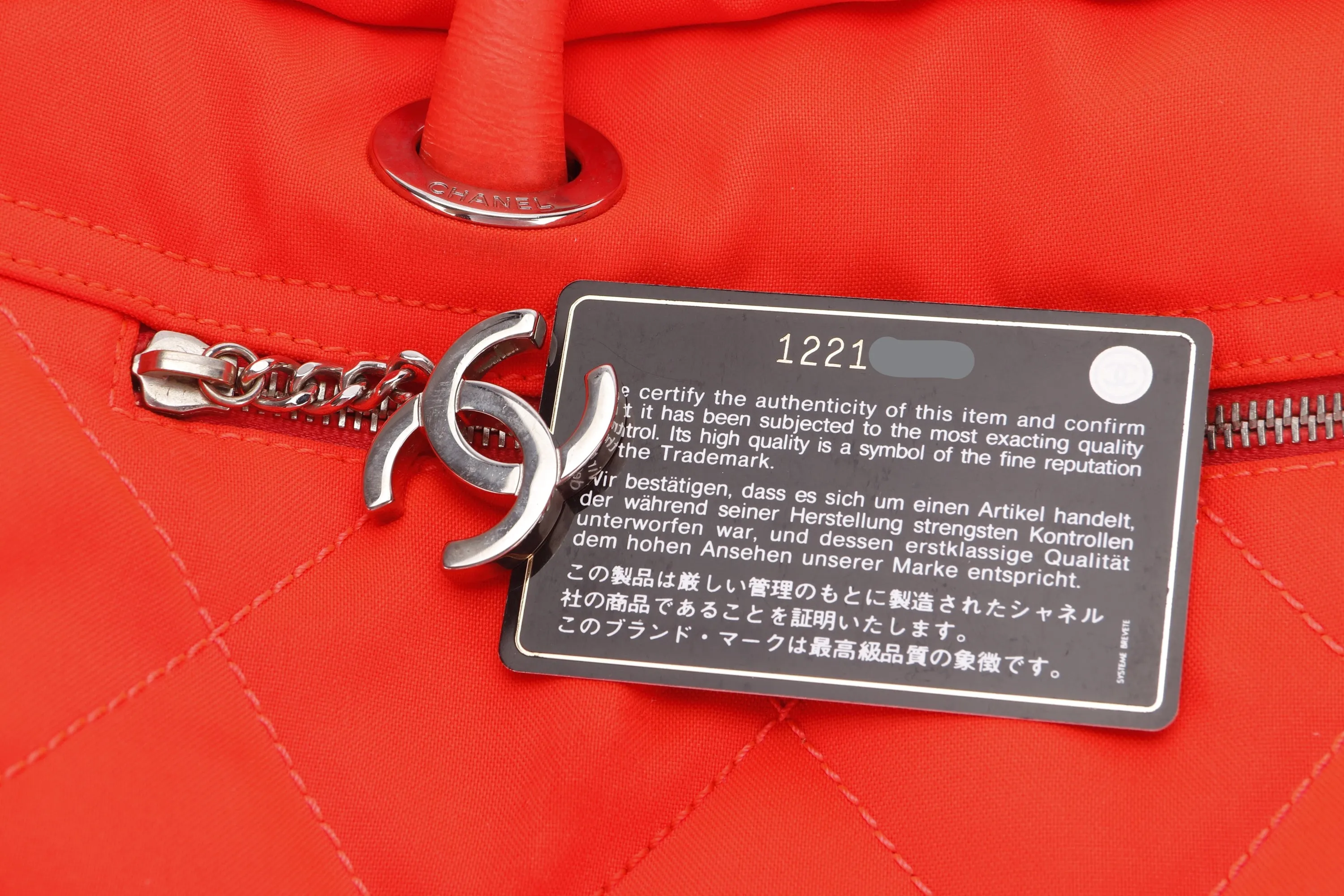 CHANEL PARIS BIARRITZ NEON ORANGE NYLON BOWLER BAG (1221xxxx), WITH CARD